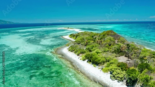 Truly amazing tropical island in the middle of the ocean. Aerial view of an island with white sand beaches and beautiful lagoons