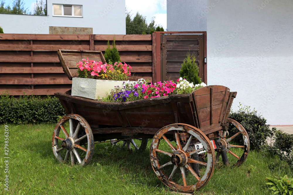 A flower bed stylized as a cart.