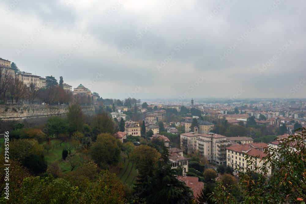 Aerial panoramic view on foggy Bergamo town in northern Italy