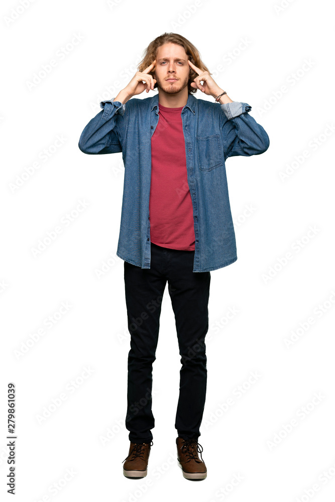 Full-length shot of Blonde man having doubts and thinking over isolated white background Full-length shot of Blonde man having doubts and thinking over isolated white background