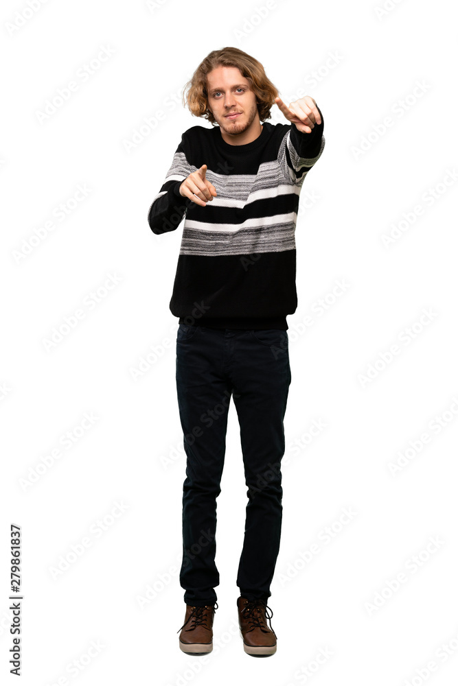 Full-length shot of Blonde man points finger at you while smiling over isolated white background Full-length shot of Blonde man points finger at you while smiling over isolated white background