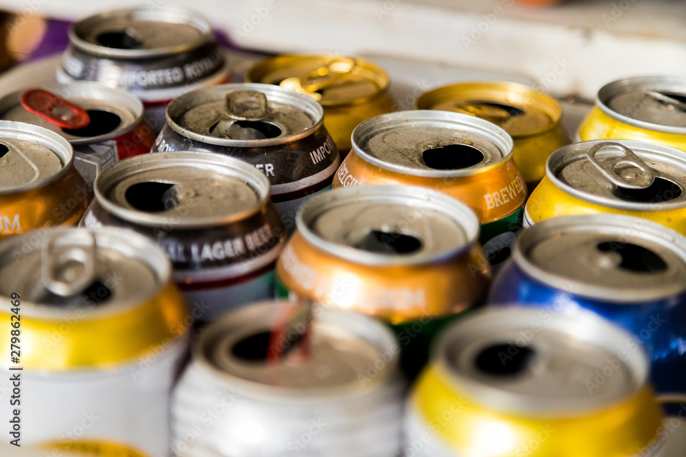 Macro of open and dusty beer cans Macro of open and dusty beer cans