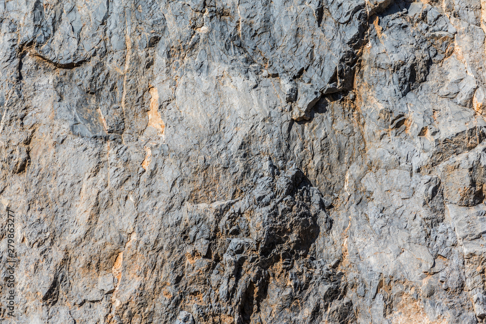 background and texture of mountain layers and cracks in sedimentary rock on cliff face. Cliff of rock mountain. background and texture of mountain layers and cracks in sedimentary rock on cliff face. Cliff of rock mountain.
