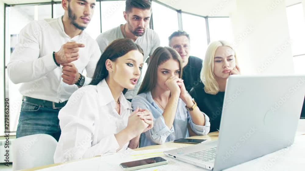 Young startup team in the moment of reaching the success Happiness and joy in faces and gestures Slow motion Young startup team in the moment of reaching the success Happiness and joy in faces and gestures Slow motion