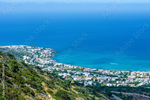 Top view from the mountains to the village of Malia, roads and the nearby villages of the field and the Aegean Sea. Crete, Greece