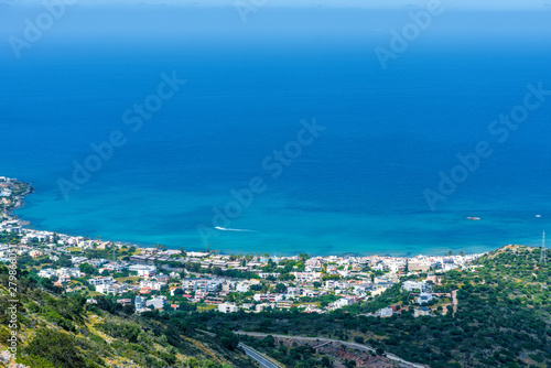 Top view from the mountains to the village of Malia, roads and the nearby villages of the field and the Aegean Sea. Crete, Greece