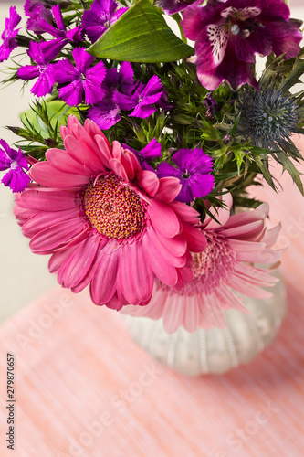 Pink and purple flowers in vase