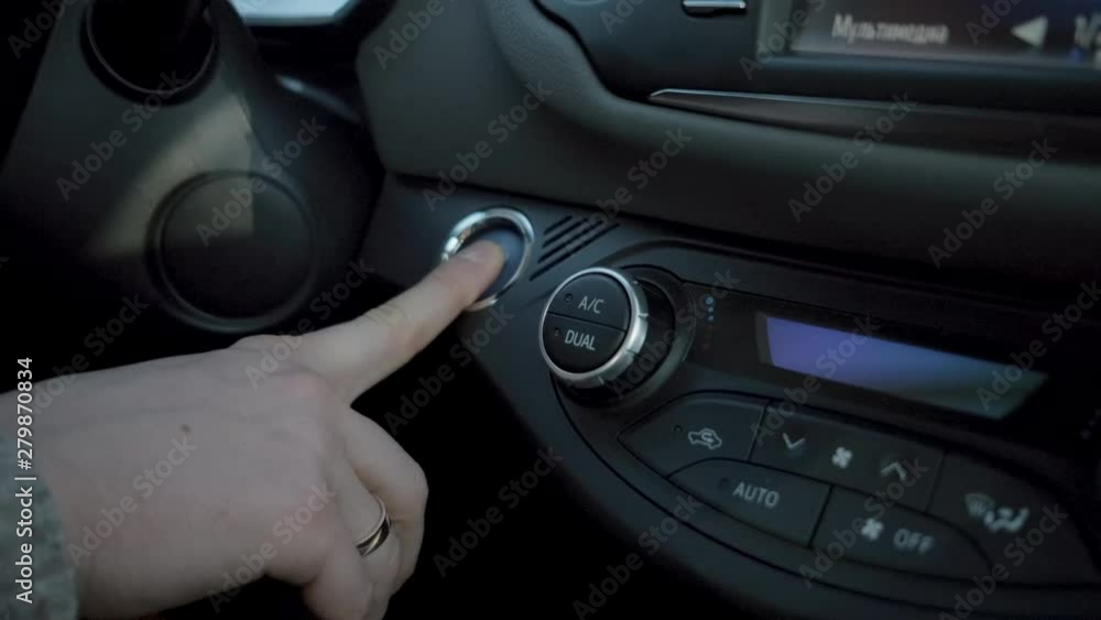 Man is switching on trip computer in auto Man is switching on trip computer in auto