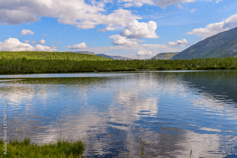 Beautiful landscape of the mountain lake Small Vudyavr in the Khibiny Mountains on a sunny day. Kola Peninsula, Russia.