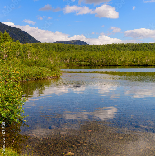 Beautiful landscape of the mountain lake Small Vudyavr in the Khibiny Mountains. Kola Peninsula, Russia.