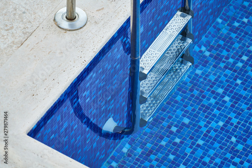a blue pool and ladder