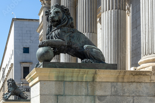 Lion statue at the entrance of the Spanish Parliament (Congreso de los Diputados), Madrid, Spain photo