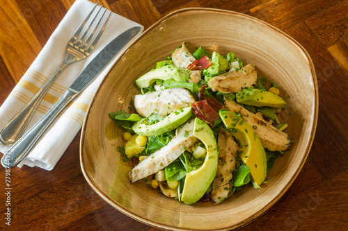 Mexican food: salad with chicken, avocado and vegetables