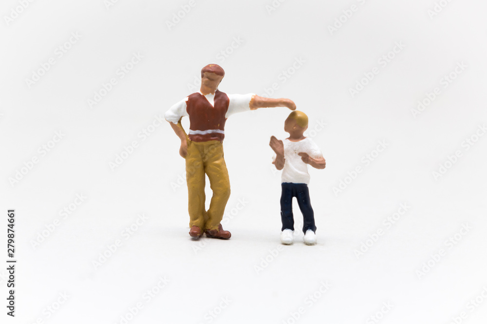 Someone tall putting their hand over a shorter person, Someone who thinks they're better, teasing Someone tall putting their hand over a shorter person, Someone who thinks they're better, teasing