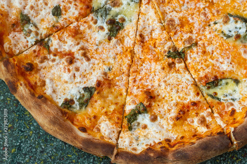 Cheese spinach pizza slices