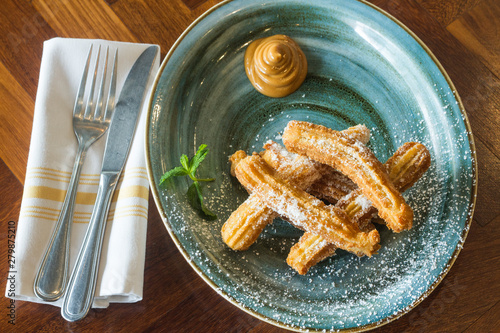 Caramel dessert with sugar bread