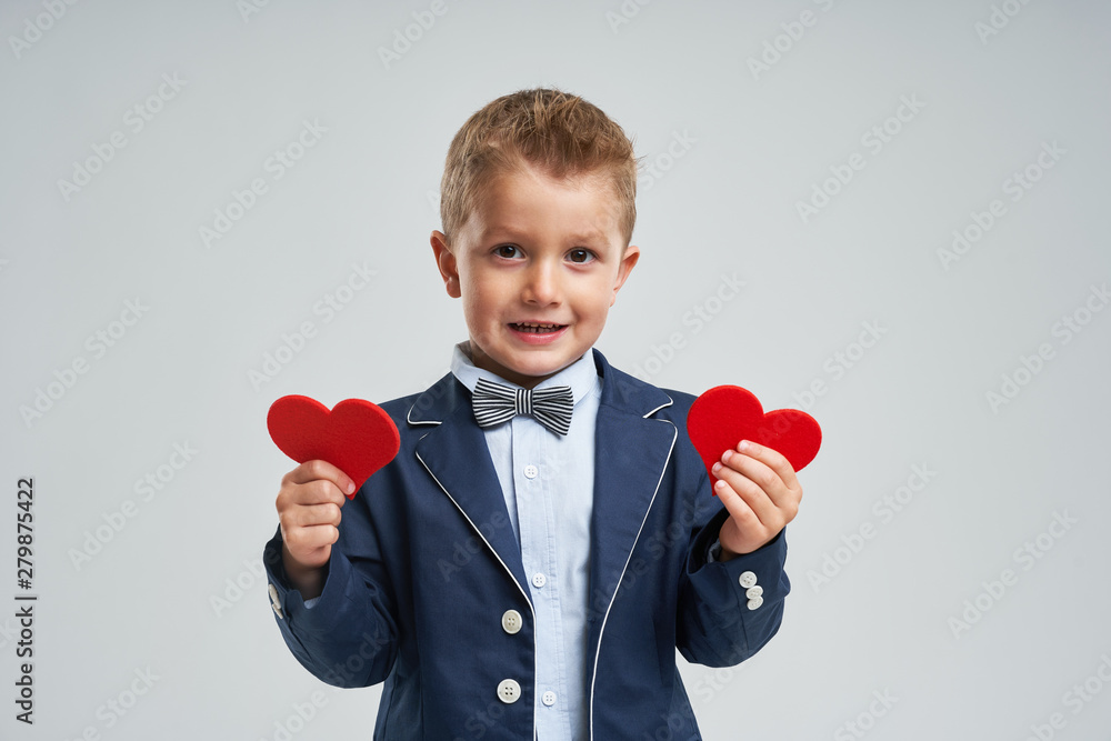 Portrait of happy cute little kid holding red heart Portrait of happy cute little kid holding red heart