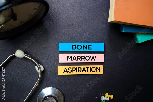 Bone Marrow Aspiration text on Sticky Notes. Top view isolated on black background. Healthcare/Medical concept photo