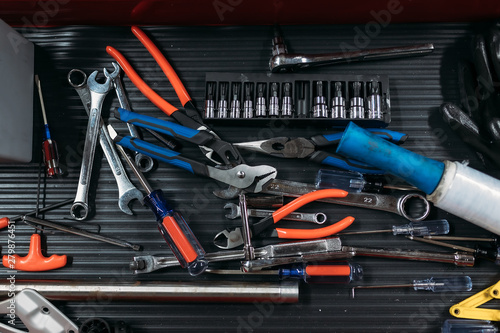 set of tools on black background. working table. mechanic industry flat lay concept top view