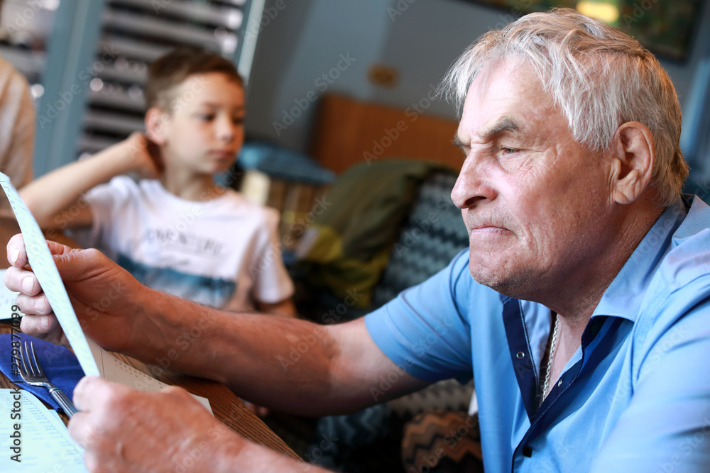 Obraz premium Senior man with menu restaurant