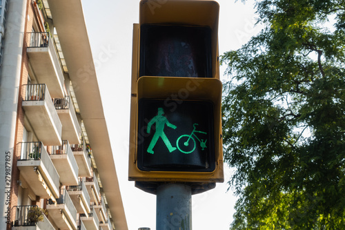 traffic light lighting green for pedestrians and bikes