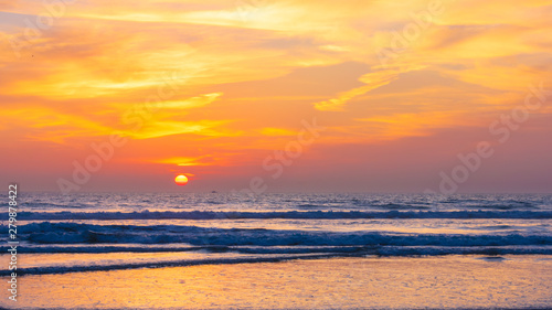 Wave in the sea with colorful sunset sky background at Oceanside California, USA.