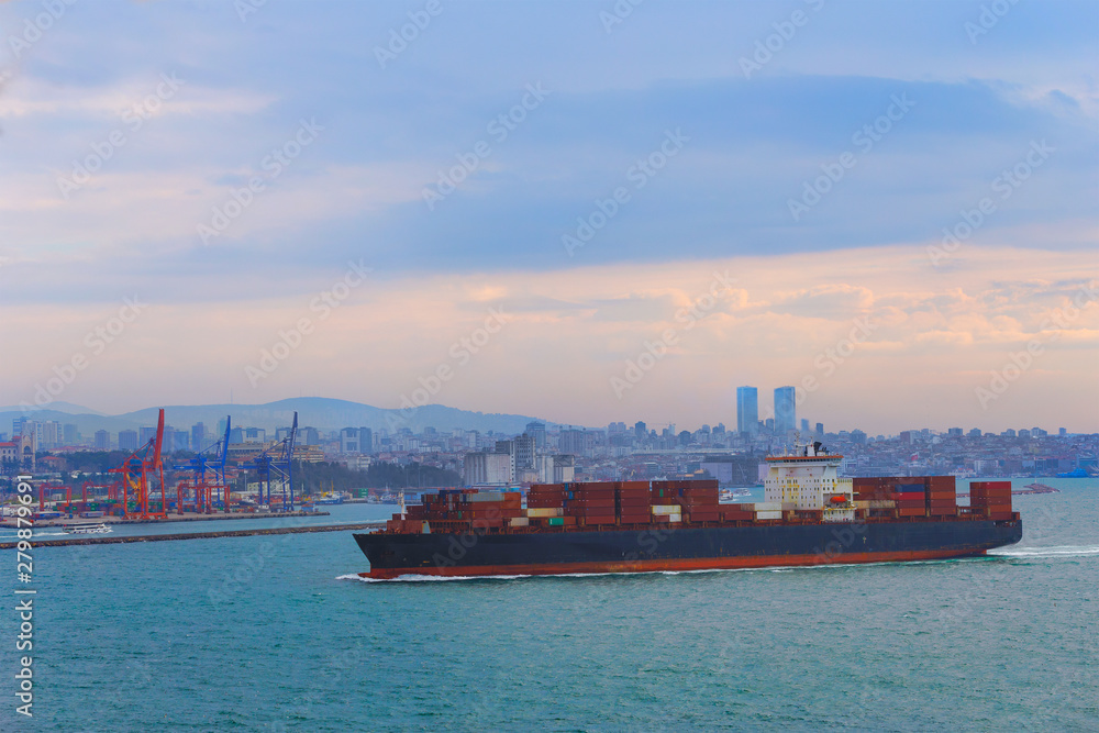 Large cargo container ship passing through Bosphorus, Istanbul, panorama of bosphorus