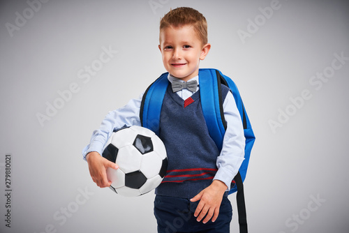 Portrait of a boy ready to school isolated on white © Kalim