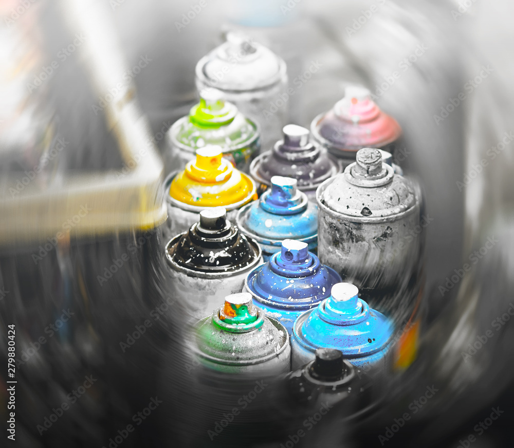 Bright stained paint cans belonging to a street artist. Graffiti and spray painting is a bold and creative solution Bright stained paint cans belonging to a street artist. Graffiti and spray painting is a bold and creative solution