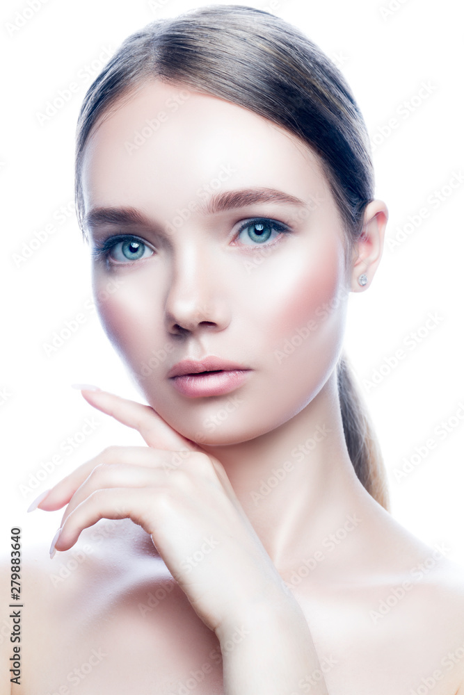 Fototapeta premium Beaty studio portrait of attractive young woman with healthy perfect skin, nude natural make-up, hand near face. Skincare facial treatment spa concept. Isolated. White background