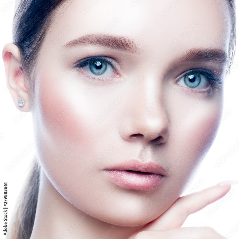 Beauty young model woman face close-up looking at camera. Hand near perfect healthy skin, natural makeup, hairstyle. Isolated. White background Beauty young model woman face close-up looking at camera. Hand near perfect healthy skin, natural makeup, hairstyle. Isolated. White background