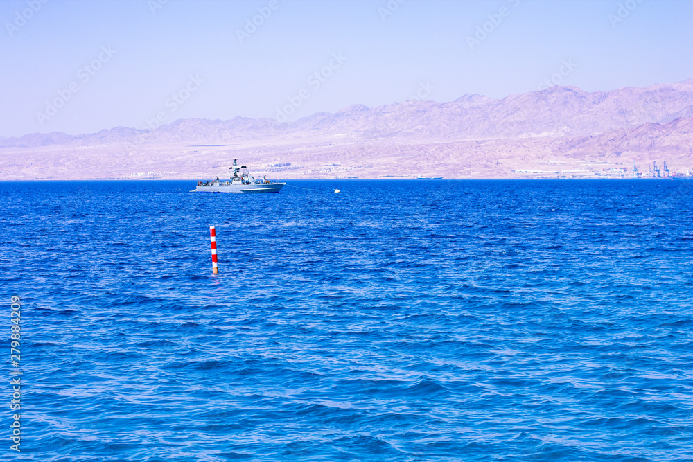 small military patrol ship protected board between Jordan and Israel in Gulf of Aqaba Red sea bay Middle East region 