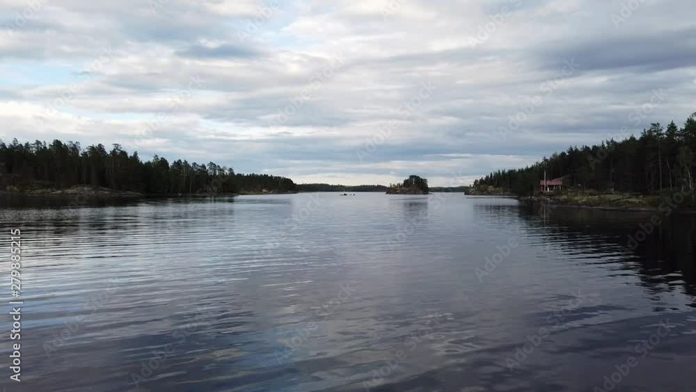 Lake Saimaa, Finland on cloudy day. Almost calm water surface. Lake Saimaa, Finland on cloudy day. Almost calm water surface.
