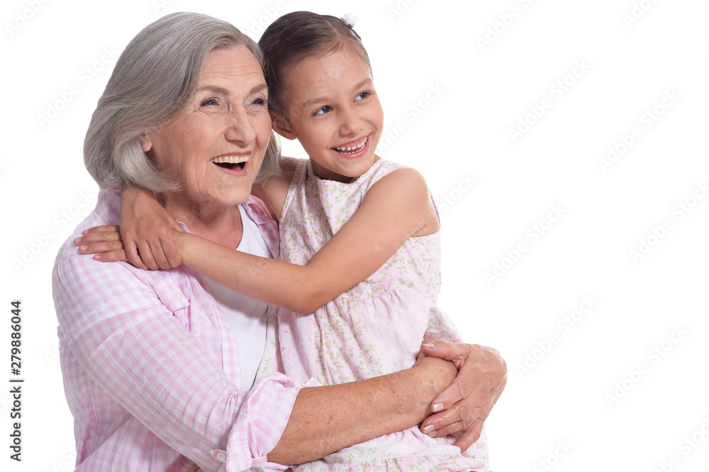 Portrait of grandmother hugging with her cute granddaughter Portrait of grandmother hugging with her cute granddaughter