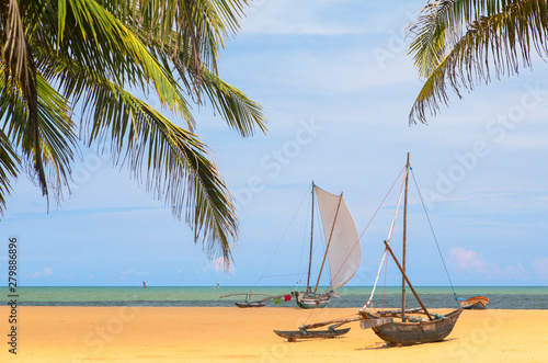 Oruwa (outrigger canoe) on Negombo beach, Western Province, Sri Lanka photo