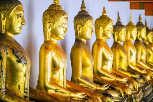 Golden Buddha statues, Wat Pho (Temple of the Reclining Buddha), Bangkok, Thailand photo