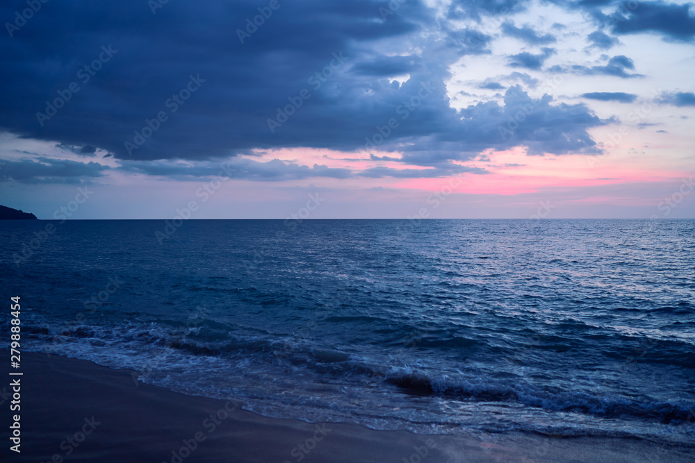 Beautiful seascape with cloudy sky. Sunset on the beach.