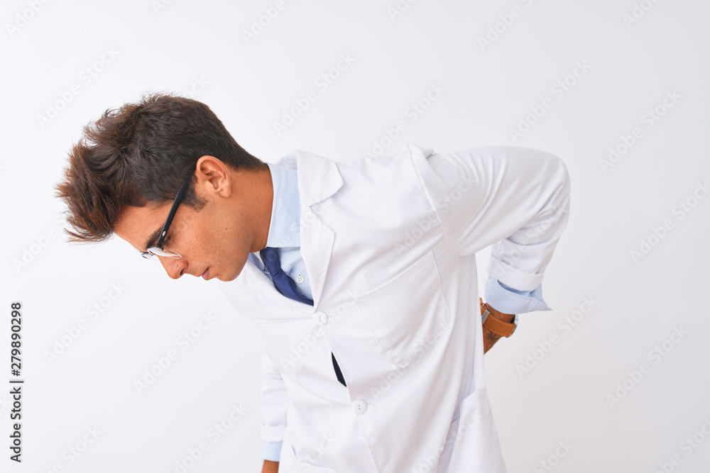 Young handsome sciencist man wearing glasses and coat over isolated white background Suffering of backache, touching back with hand, muscular pain Young handsome sciencist man wearing glasses and coat over isolated white background Suffering of backache, touching back with hand, muscular pain