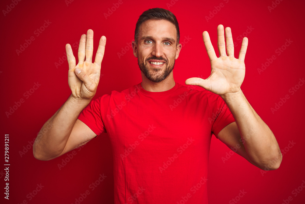 Young handsome man wearing casual t-shirt over red isolated background showing and pointing up with fingers number nine while smiling confident and happy. Young handsome man wearing casual t-shirt over red isolated background showing and pointing up with fingers number nine while smiling confident and happy.