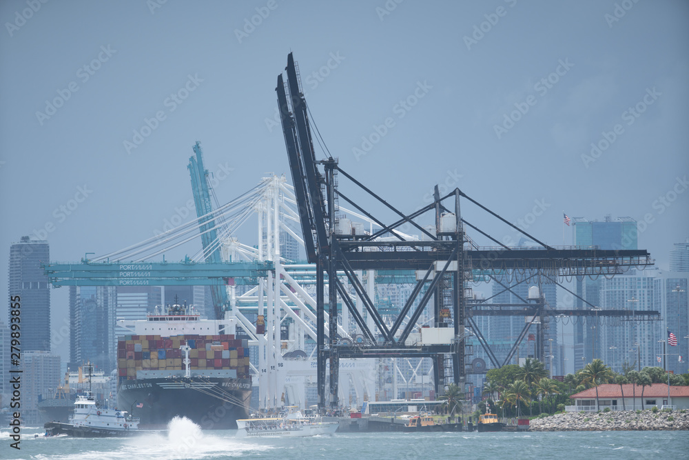 Telephoto shot Port of Miami Florida with cargo ship loading Telephoto shot Port of Miami Florida with cargo ship loading