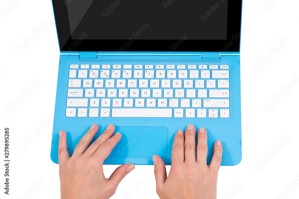 Female hands over white keyboard of blue laptop Female hands over white keyboard of blue laptop