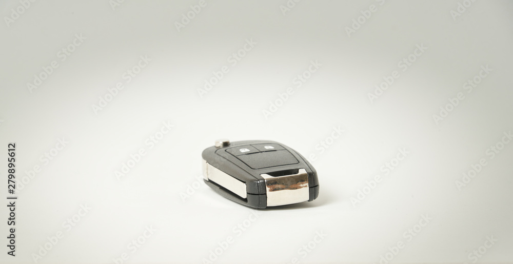 Fototapeta premium Car key on a white background. Perfect symbol to acquire a vehicle, to have property etc.