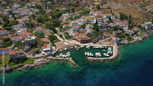 Aerial drone video of small picturesque seaside fishing village of Kamini in picturesque island of Ydra or Hydra, Saronic gulf, Greece photo