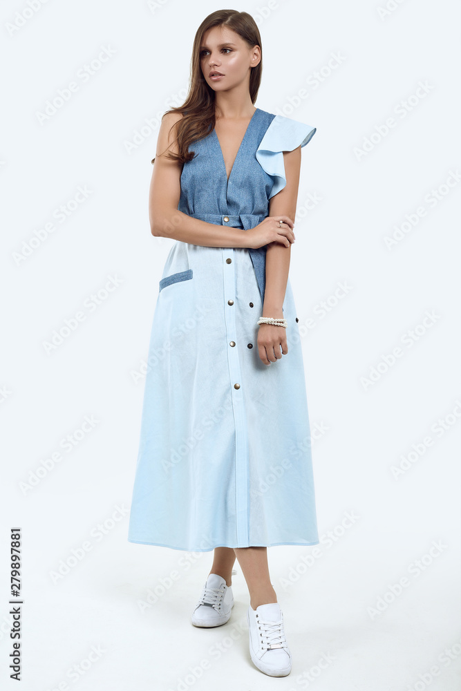 Beautiful female model with juicy lips posing in fashion dress Beautiful female model with juicy lips posing in fashion dress