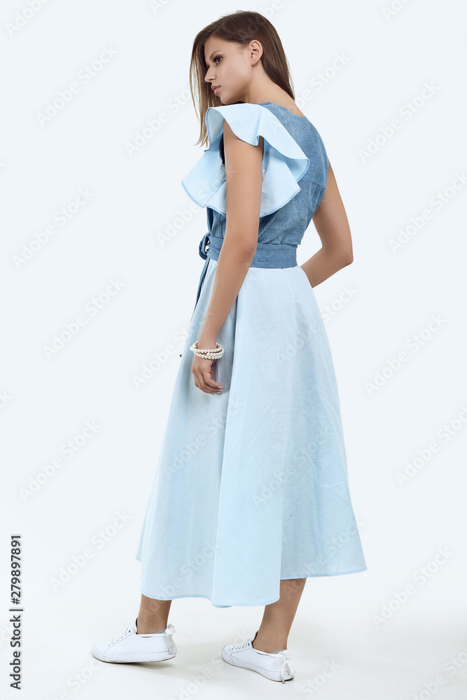 Beautiful female model with juicy lips posing in fashion dress Beautiful female model with juicy lips posing in fashion dress