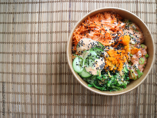 Top view of a bowl with traditional poke from Hawaii photo