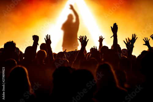 silhouettes of audience at rock concert