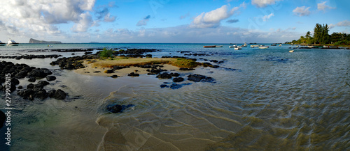 Seascape of Cap Malheureux with small boats in further background, Mauritius.