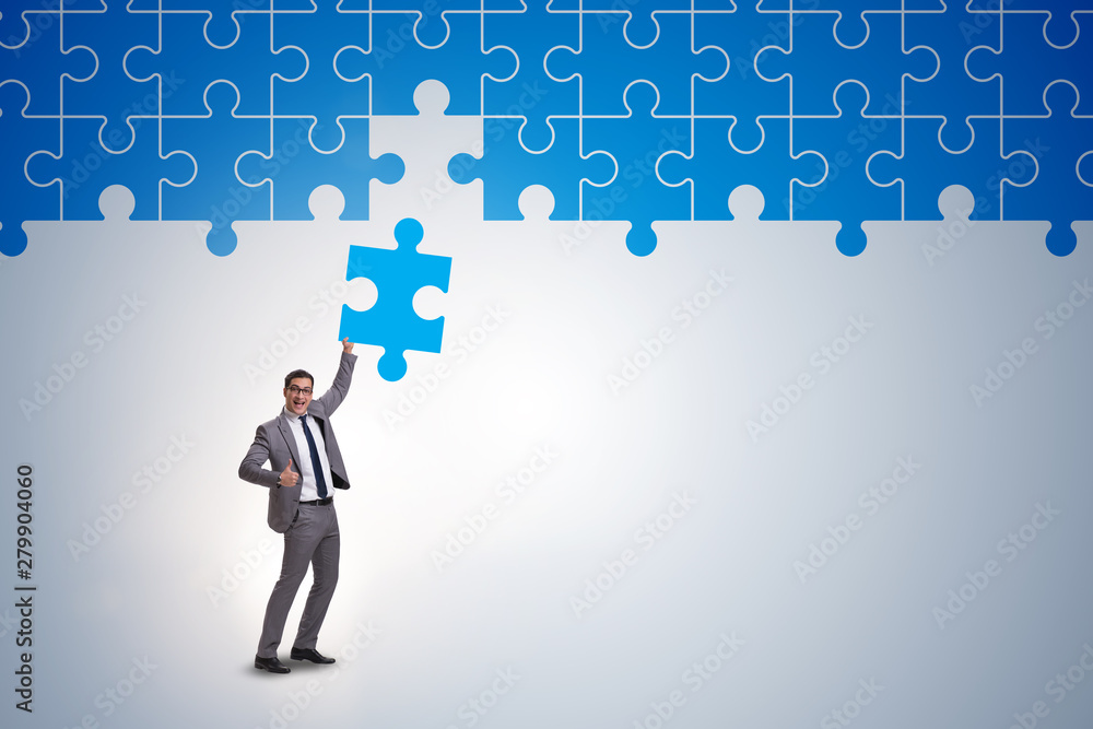 Concept of businessman with missing jigsaw puzzle piece Concept of businessman with missing jigsaw puzzle piece