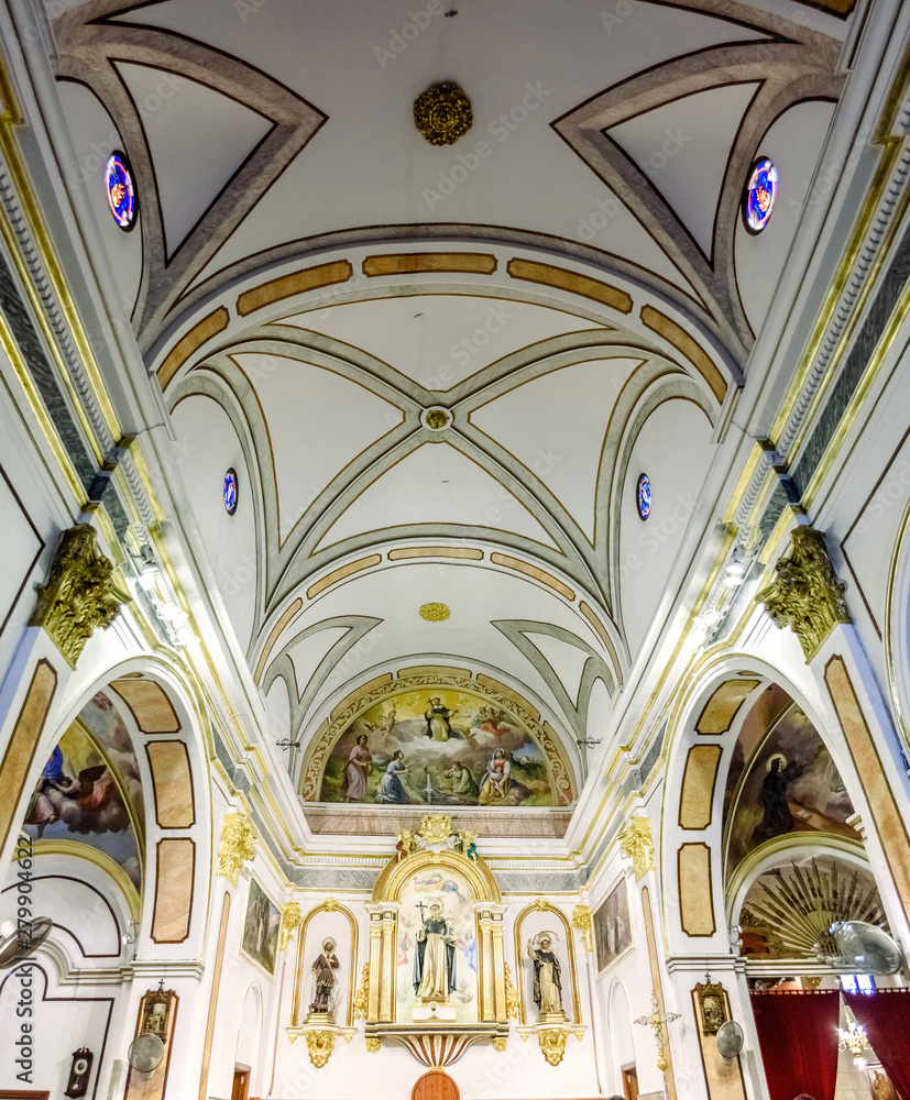 Valencia, Spain - March 30, 2019: Interior of a small church with simple decoration and white walls.